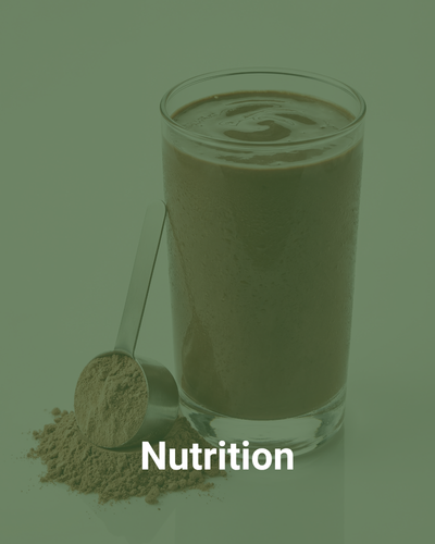 Chocolate shake in a glass and measuring spoon with poder beside it